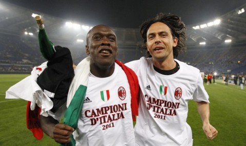 AC Milan's Clarence Seedorf (L) and Filippo Inzaghi celebrate after winning the Serie A title at the end of their match against AS Roma at the Olympic stadium in Rome May 7, 2011.  REUTERS/Giampiero Sposito (ITALY - Tags: SPORT SOCCER)